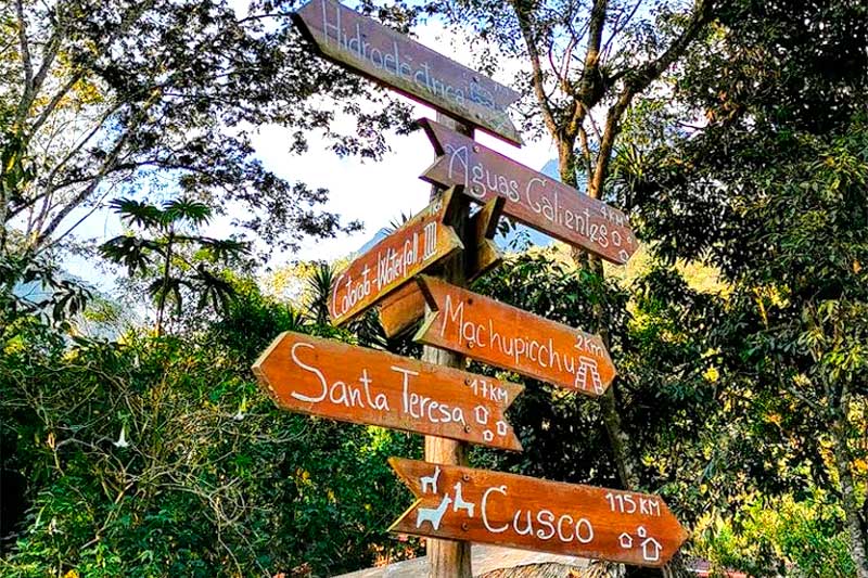 Signs on the way to Machu Picchu and Hydroelectric